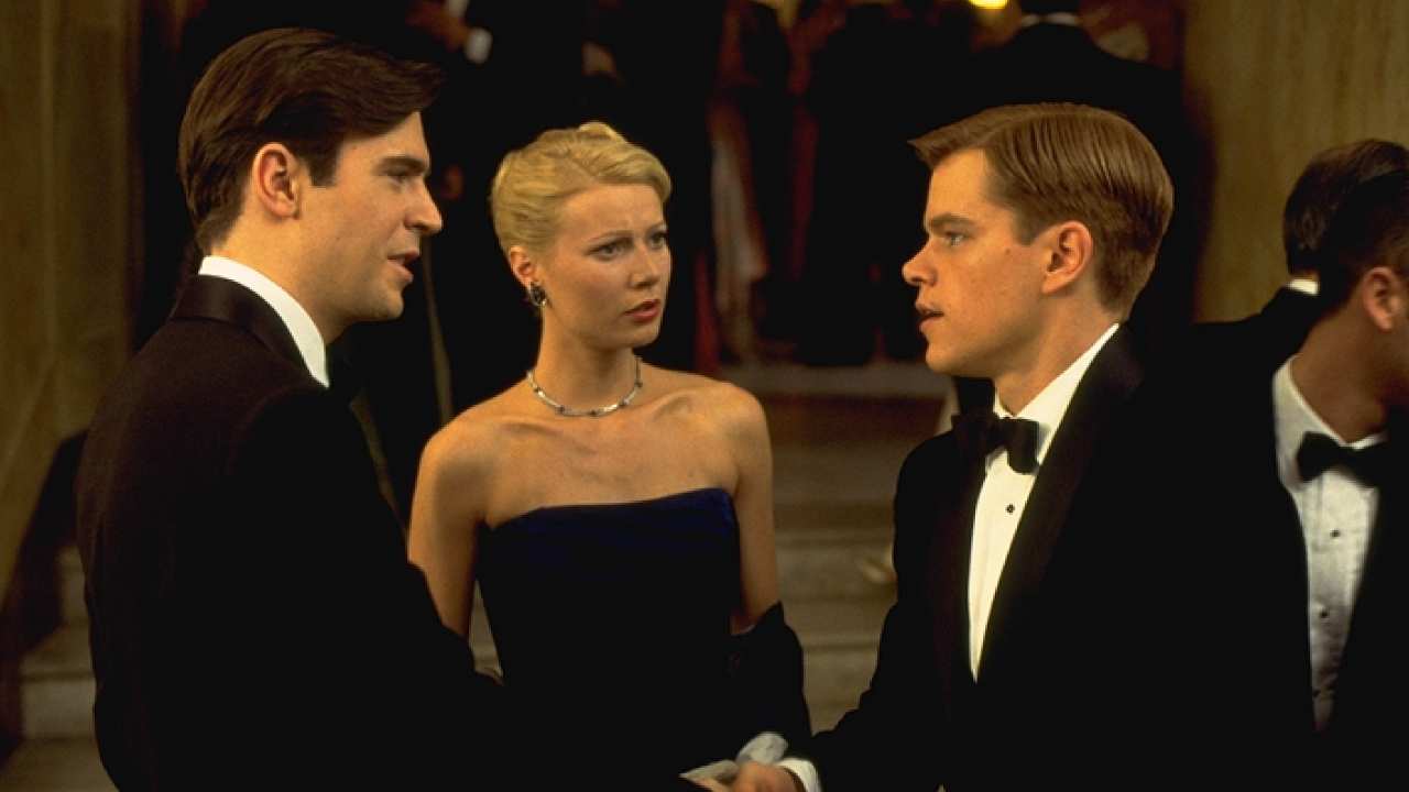 Matt Damon, Gwyneth Paltrow talking to a man